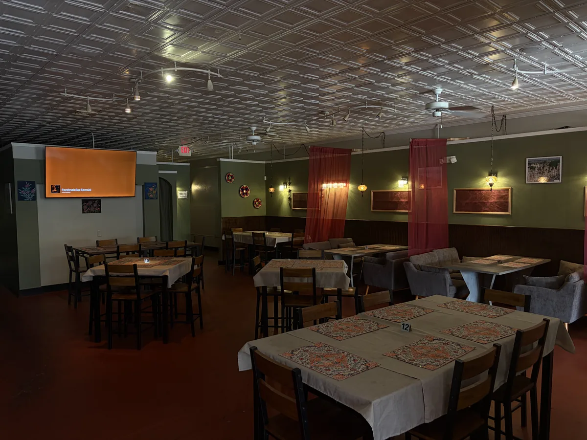 Warm, welcoming dining room seating area inside Kaboblicious